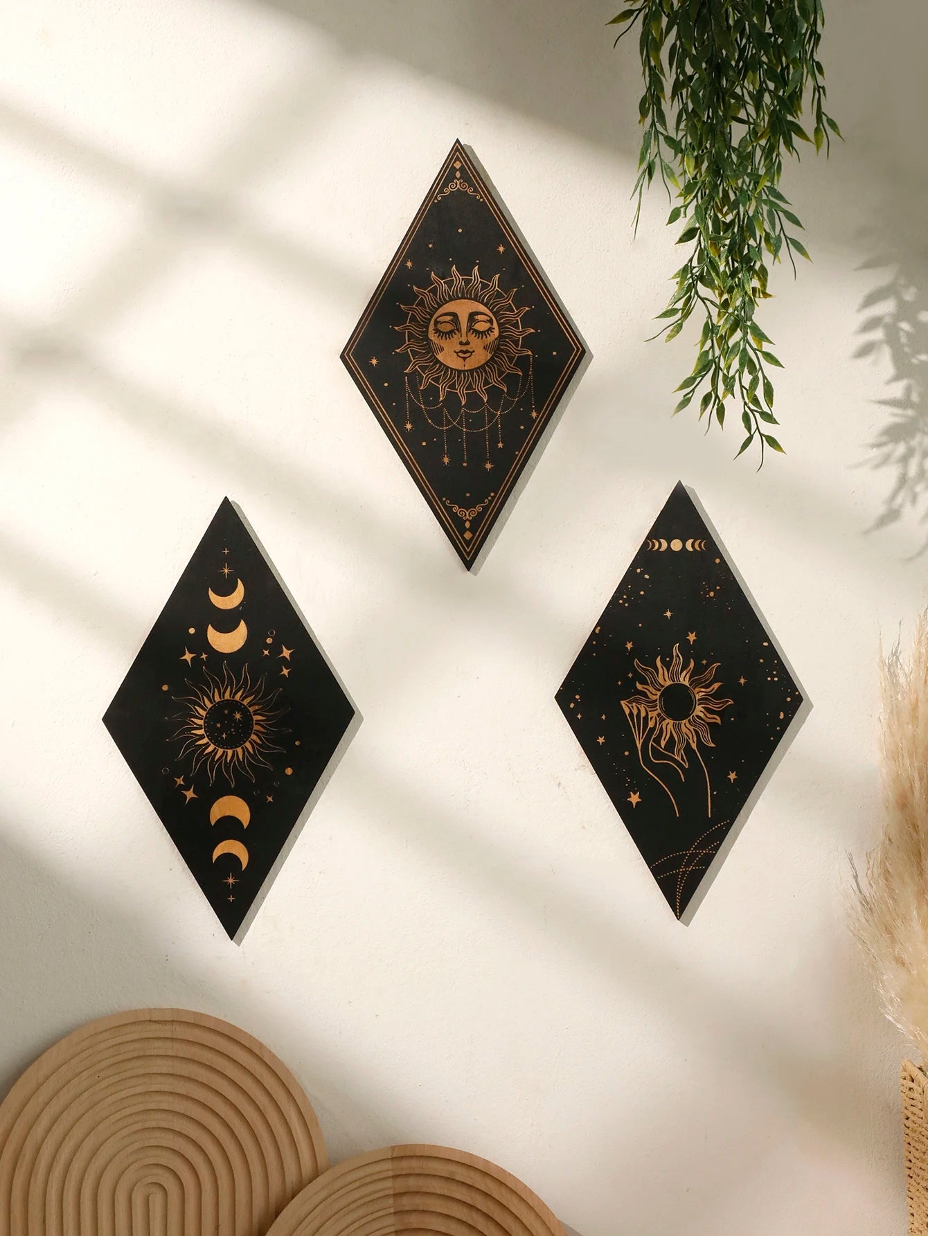 Three diamond-shaped wall art pieces with celestial designs on a light background. boho home decor, wooden witchy wall hanging, moon phase wall art, gothic home decor, celestial wall pediment, snake wall hanging, sun and moon wall decor, spiritual home accents, mystical bedroom art, witchy housewarming gift