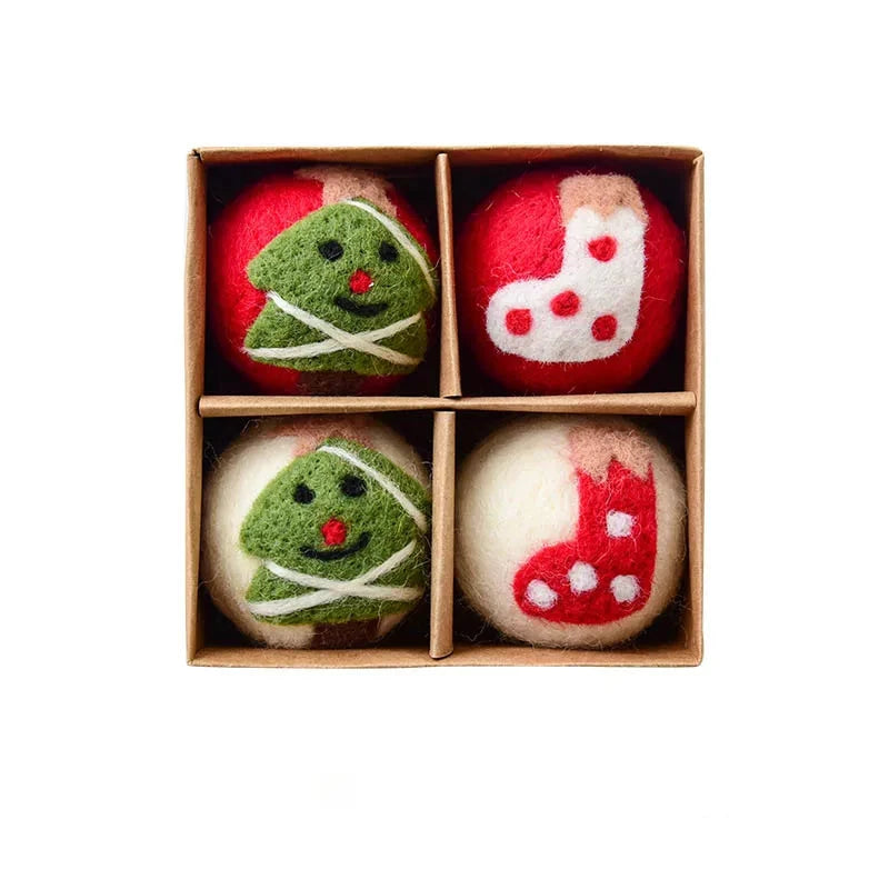 Four decorative felt wool balls with Christmas designs in a box
