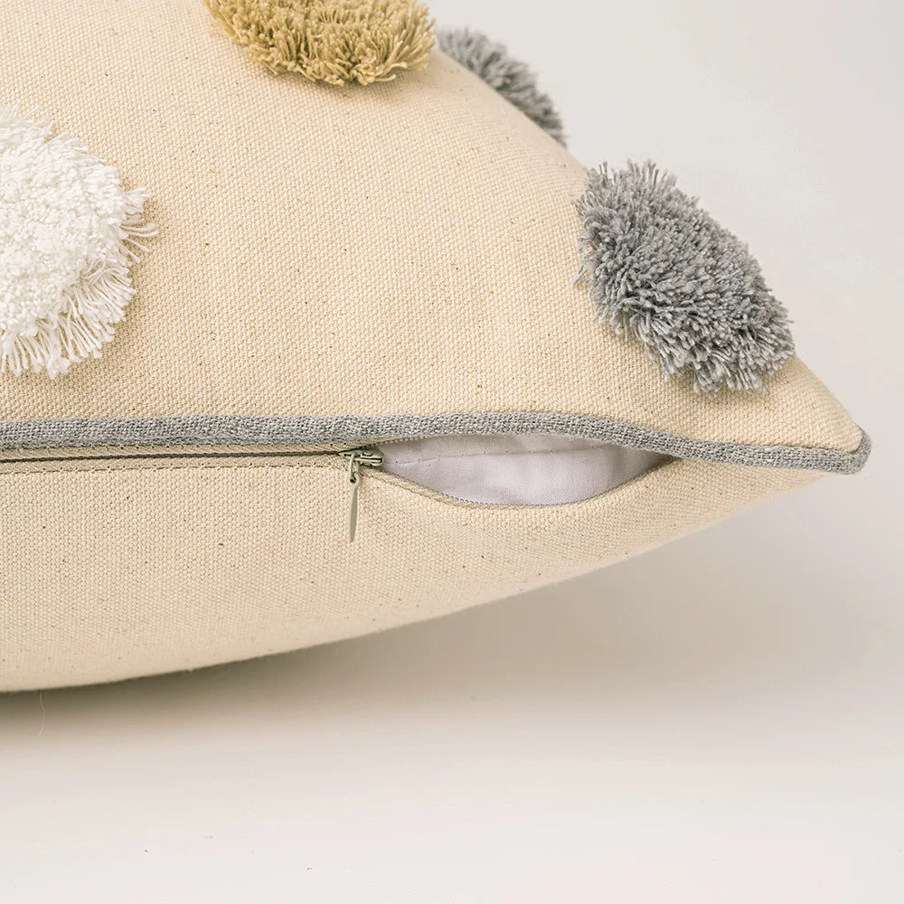 Beige pillow with colorful pom-poms on a light background. Boho cushion cover for sofa, bed, or chair 18x18 inch