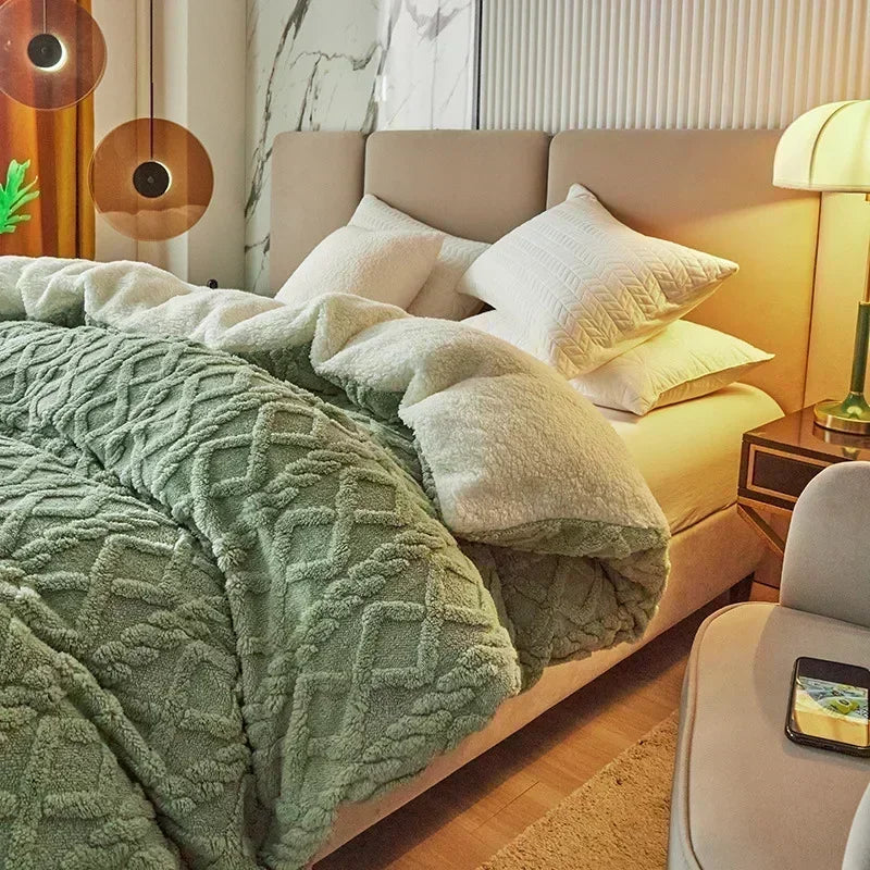 Neatly made bed with green textured blanket and pillows in a bedroom setting. Soft plush duvet cover and blanket in solid color with striped jacquard design, dual-use artificial cashmere fleece bedding for cozy winter warmth