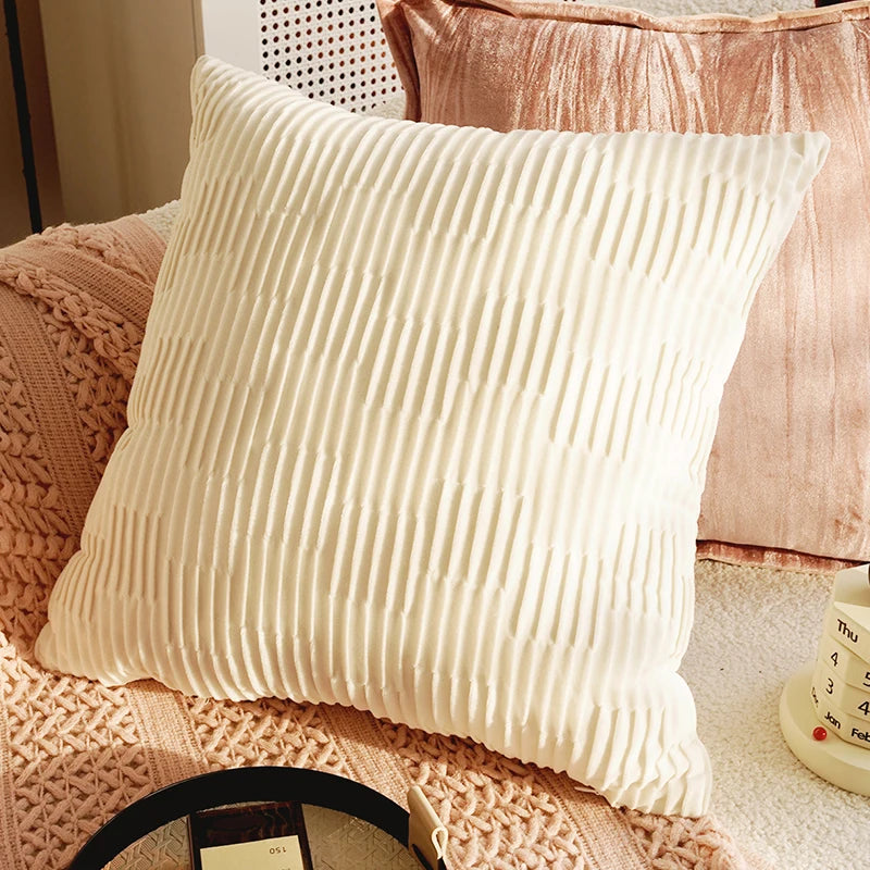 Beige textured pillow on a pink textured surface. Boho Home Decor.