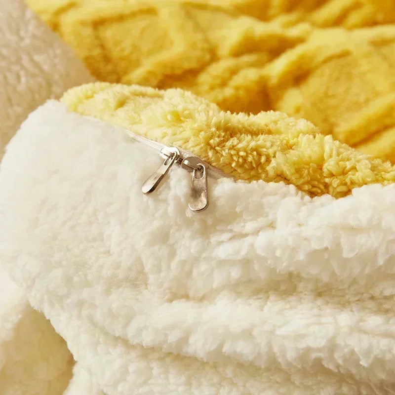 Close-up of a yellow and white textured fabric with a brand tag. Soft plush duvet cover and blanket in solid color with striped jacquard design, dual-use artificial cashmere fleece bedding for cozy winter warmth