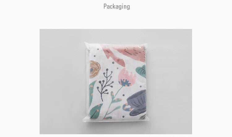 Floral-patterned packaging on a gray background. Deer forest jacquard woven blanket with floral and woodland tapestry design – boho throw for sofa or bed, soft cotton blend decorative bedspread for cozy home décor.