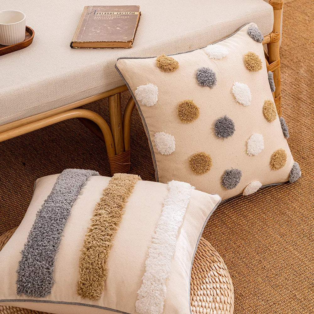 Two decorative pillows on a textured surface with a wicker chair and books in the background. Boho cushion cover for sofa, bed, or chair 18x18 inch