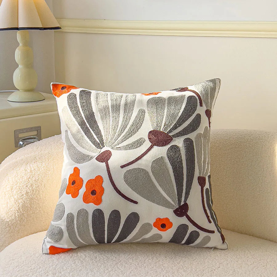 Decorative pillow with floral pattern on a couch