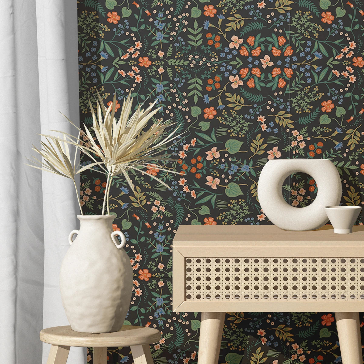 Room interior with floral wallpaper, a vase on a stool, and a table with decorative items. Black floral peel-and-stick wallpaper roll, 40 x 120 cm, waterproof and moisture-proof wall covering for stylish home decoration