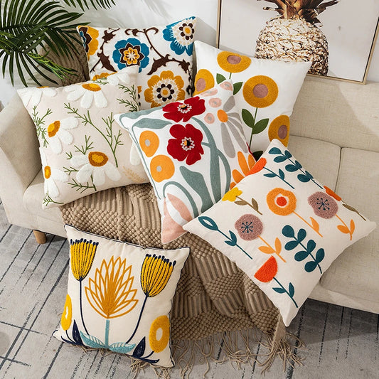 Vintage floral embroidered pillowcase styled on a sofa, boho throw cushion cover adds texture and charm to bohemian home decor, perfect for cozy living room decor, eclectic home styling, and unique boho gifts under $50