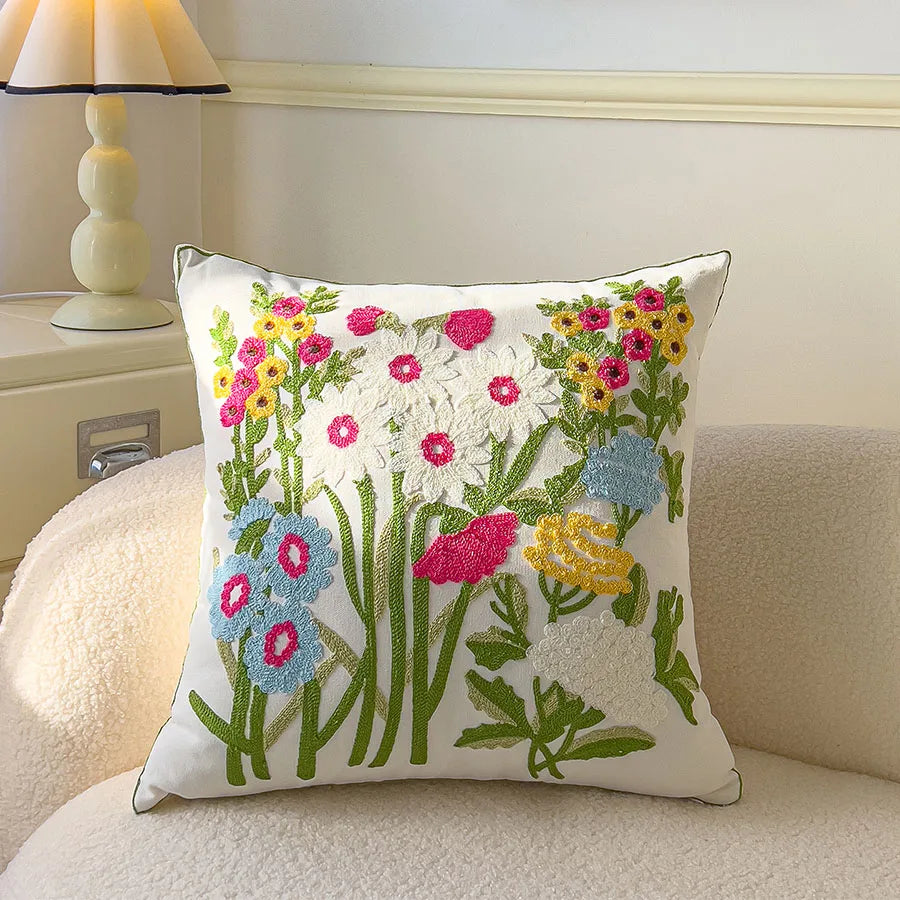 Decorative pillow with floral embroidery on a couch