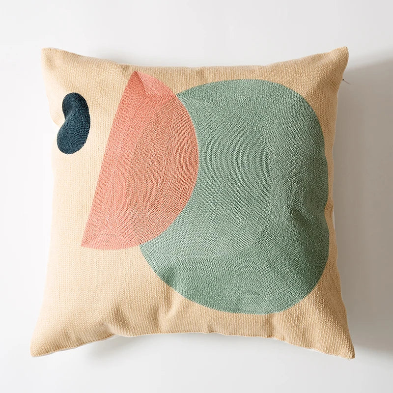 Decorative pillow with abstract shapes on a beige background Colorful abstract geometric embroidered cushion cover in cotton blend, decorative pillowcase for living room, kids’ room, or boho home decor.
