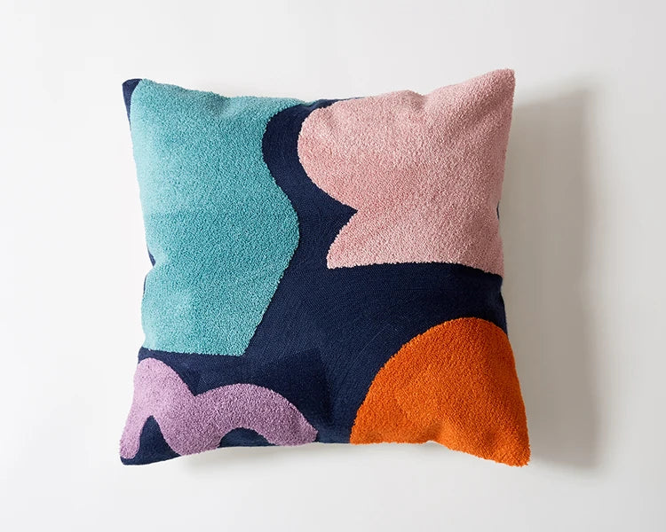 Colorful abstract-patterned pillow on a white background Colorful abstract geometric embroidered cushion cover in cotton blend, decorative pillowcase for living room, kids’ room, or boho home decor.