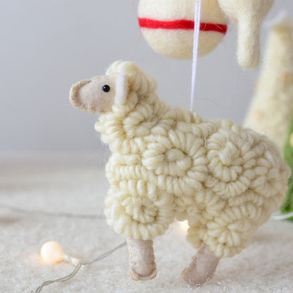 White sheep toy with fluffy texture on a light background