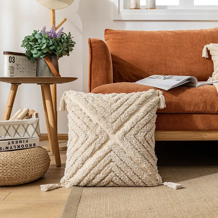 Decorative pillow with geometric pattern on a couch in a living room setting