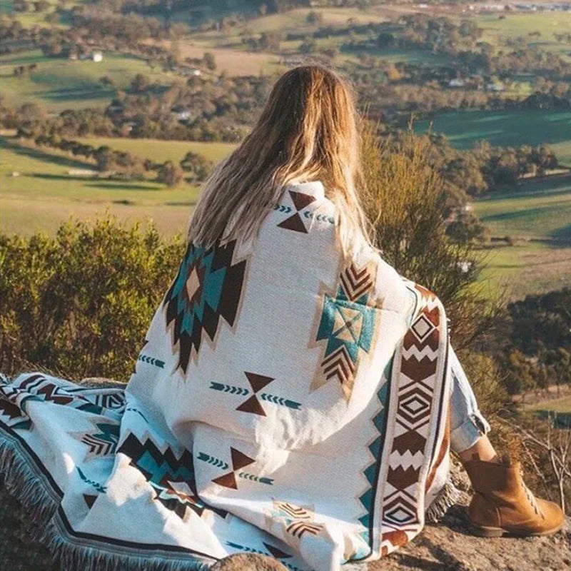 Boho geometric Aztec throw blanket with tassels, featuring earthy tones and a woven texture—perfect for cozy home decor