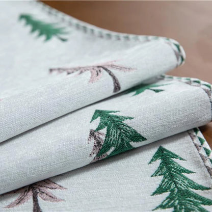 Stack of fabric with tree pattern on a wooden surface