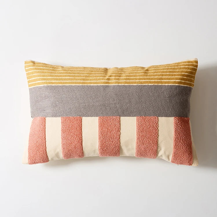 Striped pillow with yellow, gray, pink, and beige colors on a white background Colorful abstract geometric embroidered cushion cover in cotton blend, decorative pillowcase for living room, kids’ room, or boho home decor.