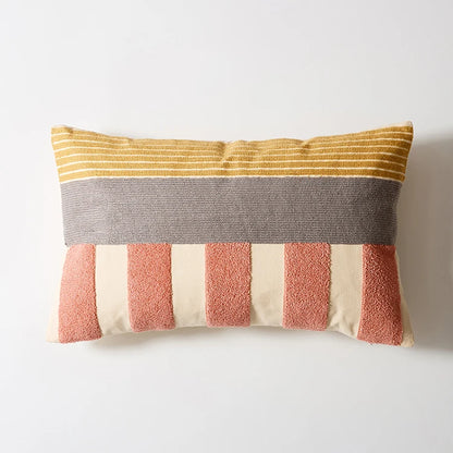 Striped pillow with yellow, gray, pink, and beige colors on a white background Colorful abstract geometric embroidered cushion cover in cotton blend, decorative pillowcase for living room, kids’ room, or boho home decor.