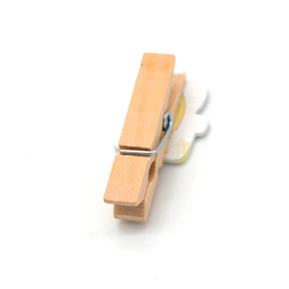 Wooden clothespin on a white background