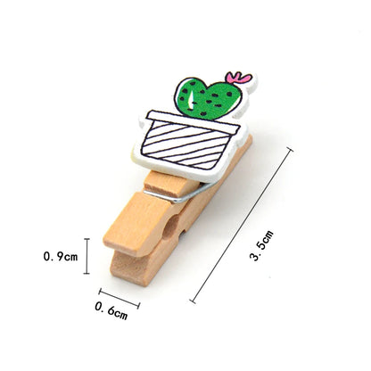 Wooden clip with cactus design and measurements on a white background