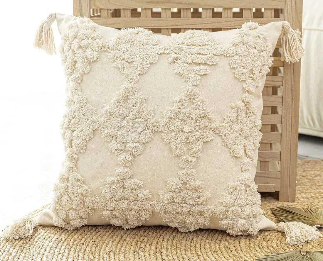 Decorative pillow with tassels on a wooden chair