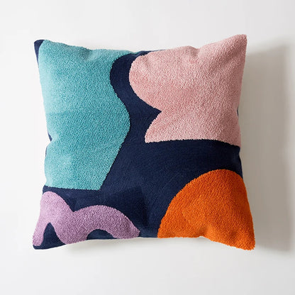 Colorful abstract-patterned pillow on a white background Colorful abstract geometric embroidered cushion cover in cotton blend, decorative pillowcase for living room, kids’ room, or boho home decor.