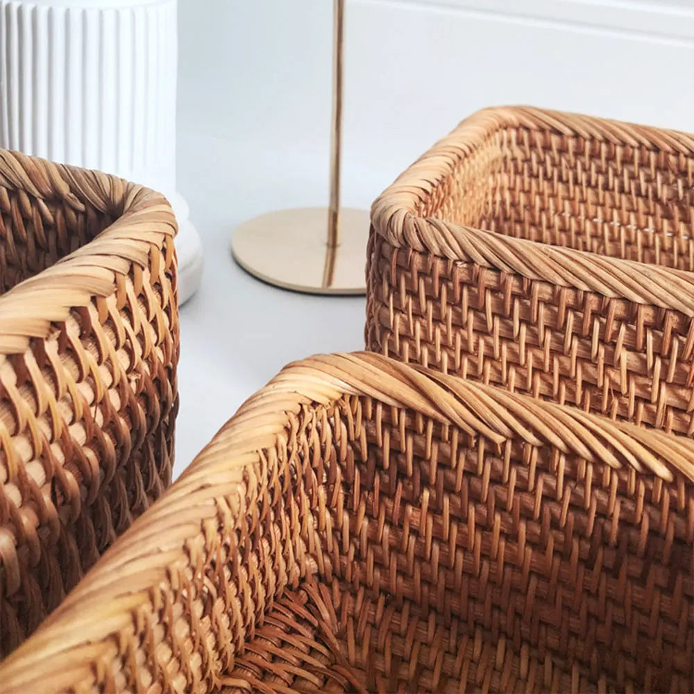 Close-up of woven wicker chairs with a white wall in the background boho home decor, rattan basket, handwoven wicker basket, fruit storage box, bread basket, picnic basket, natural storage bin, tea storage box, rustic home organization, farmhouse decor, housewarming gift, boho storage basket