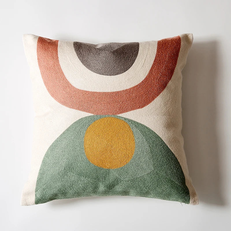 Decorative pillow with geometric pattern on a plain background Colorful abstract geometric embroidered cushion cover in cotton blend, decorative pillowcase for living room, kids’ room, or boho home decor.