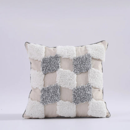 Decorative pillow with a checkered pattern on a light gray background