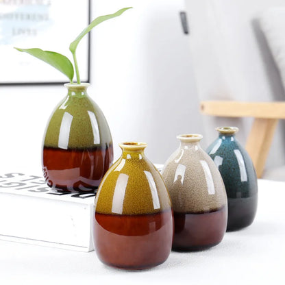 Set of ceramic boho vases with gradient colors on a white surface