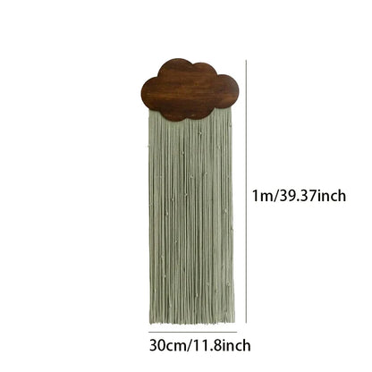 Decorative cloud-shaped wall art with tassels, showing dimensions on a white background.