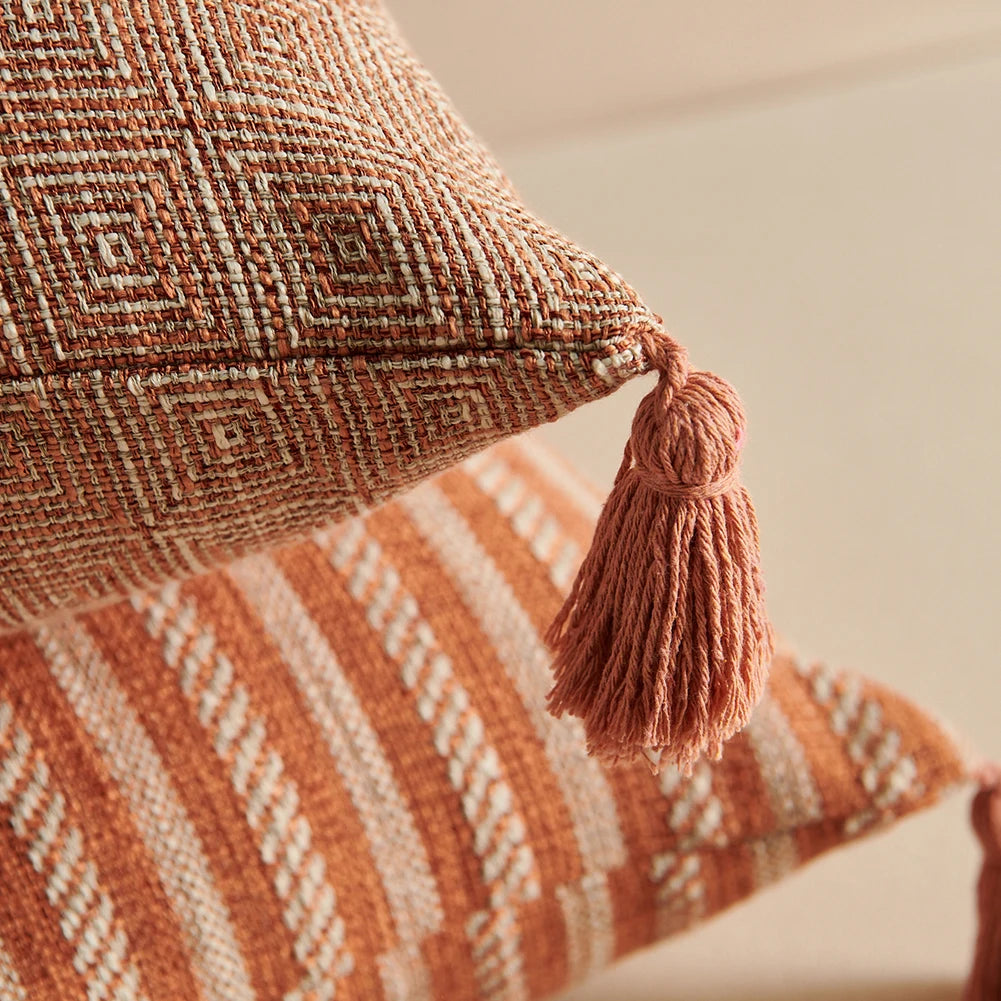 Orange linen tassels cushion cover styled on modern sofa, decorative boho throw pillow for living room, bed, or chair, perfect for cozy home vibes and housewarming gift ideas. Square and Rectangle.