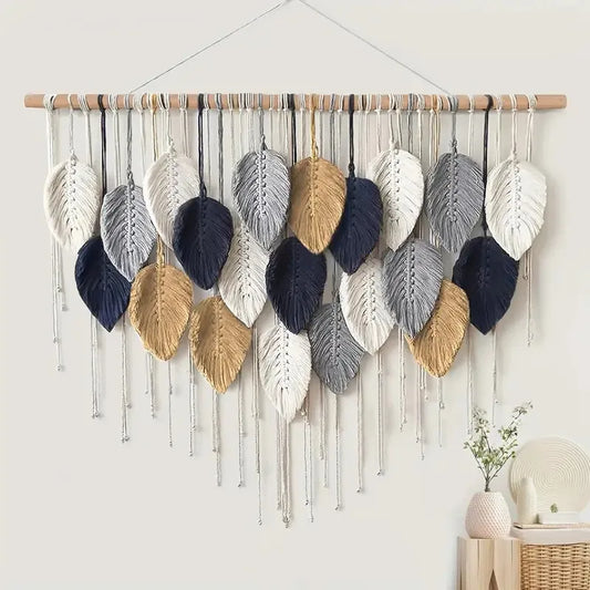 Woven wall art with leaf-shaped decorations in various colors on a white wall.