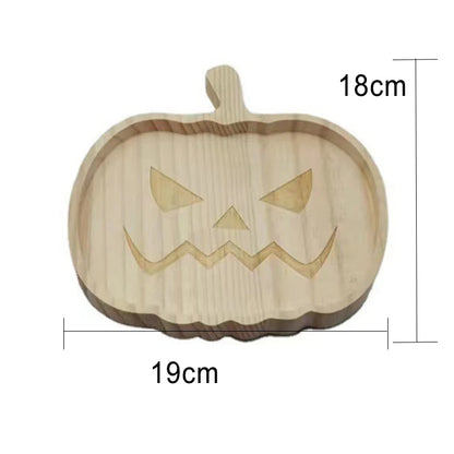 Wooden pumpkin-shaped cutting board with carved face design and measurements on a white background. Wooden Halloween serving tray in pumpkin and ghost shapes, rustic snack and dessert plate for party décor and fall entertaining