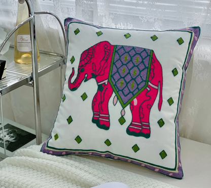 Decorative pillow with a pink elephant design on a white surface, floral embroidery on linen cotton cushion cover – boho home decor accent