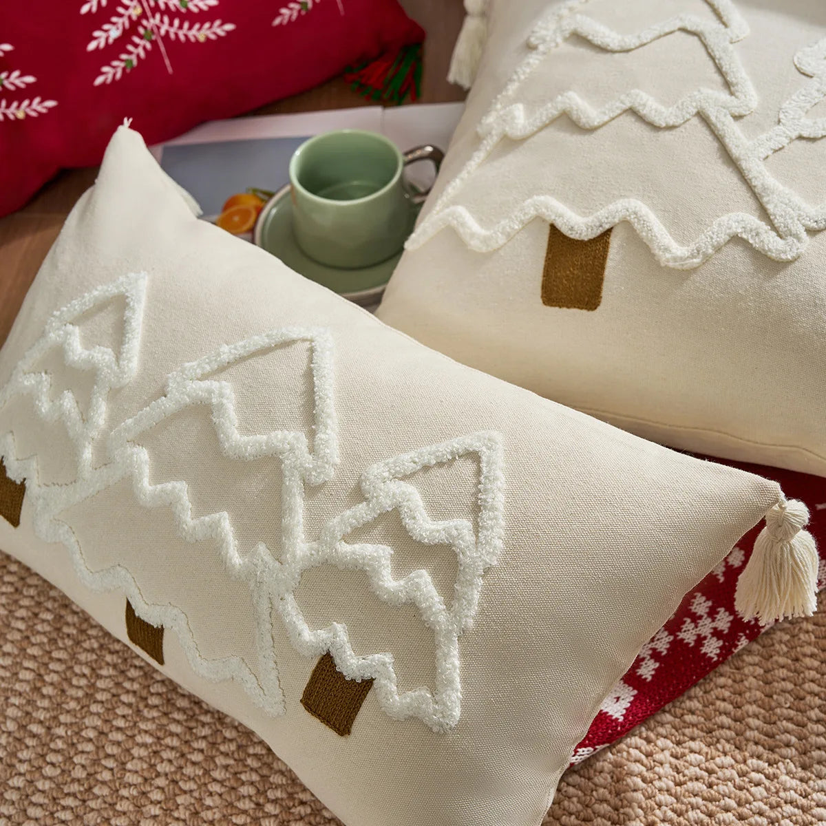 Decorative pillows with gingerbread house designs on a textured surface. tufted Christmas pillow cover with tassels, decorative festive cushion case for sofa or bed in 12x20 or 18x18 inches.