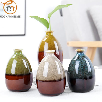 Set of four ceramic vases with gradient colors on a white surface for boho home decor