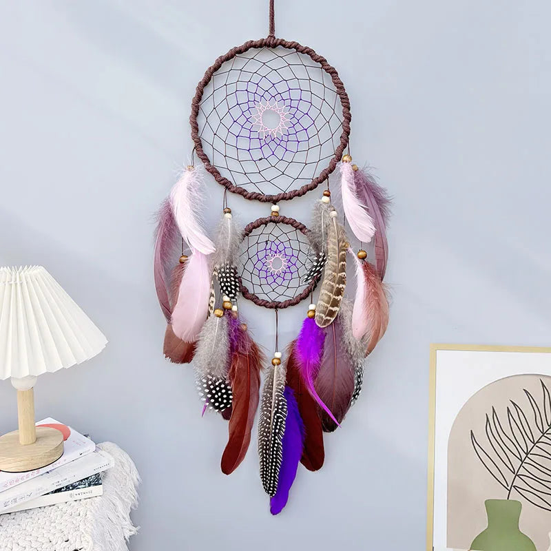 Dreamcatcher with feathers hanging on a light blue wall. boho home decor, housewarming gift, dream catcher wall hanging, feather wind chime, handmade dreamcatcher, colorful boho wall decor, birthday gift decor, modern bohemian style, bedroom hanging ornament, spiritual home decor, dreamcatcher nursery decor