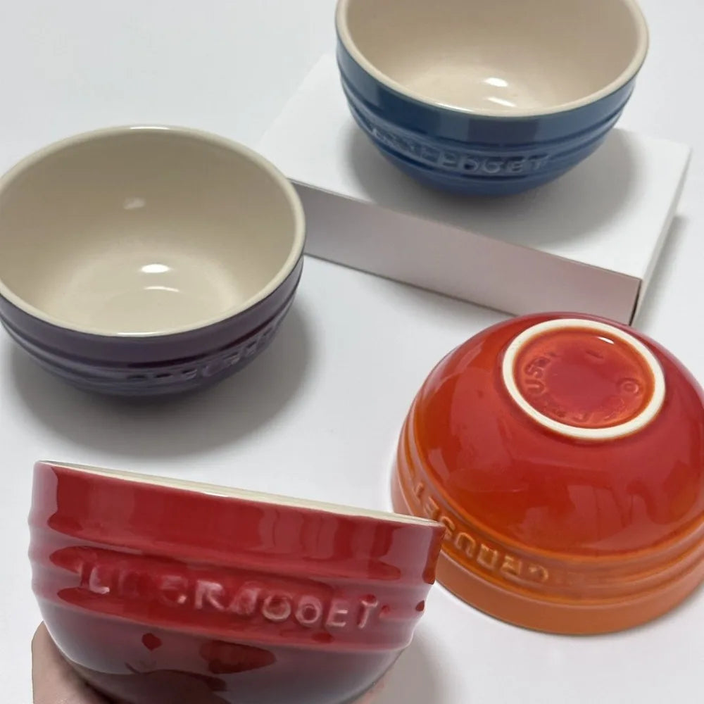 Set of ceramic bowls in various colors on a white surface Gradient ceramic rice bowl in bright colors, bone china soup and noodle bowl, dessert and pudding kitchen tableware for boho home dining
