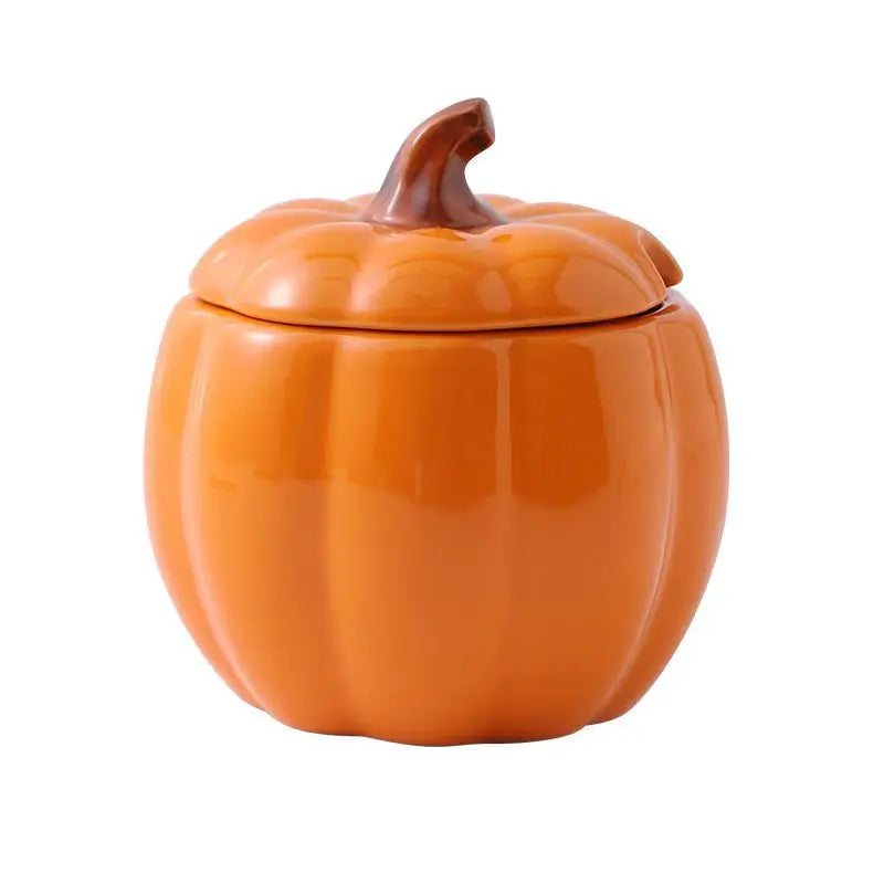 Orange pumpkin-shaped ceramic jar with a lid on a white background. Pumpkin-shaped ceramic bowl with lid kitchen container Halloween and Thanksgiving fall serving dish