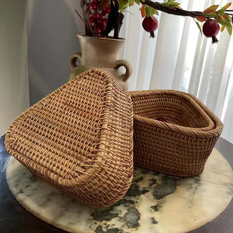 Woven baskets on a marble surface with a vase and pomegranate branch in the background. boho home decor, rattan basket, handwoven wicker basket, fruit storage box, bread basket, picnic basket, natural storage bin, tea storage box, rustic home organization, farmhouse decor, housewarming gift, boho storage basket