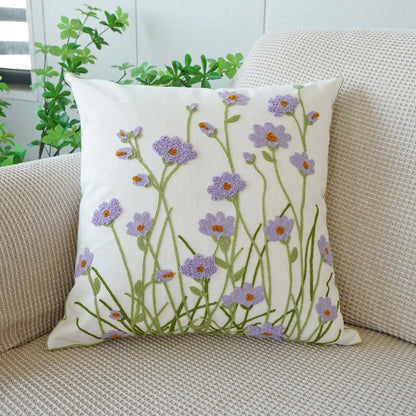 Decorative pillow with floral pattern on a beige couch. Floral embroidered throw pillow cover boho decor