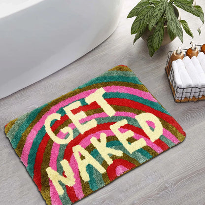 Colorful bath mat with 'GET NAKED' text on a bathroom floor. boho home decor, bathroom rug, tufted bath mat, Get Naked rug, colorful shower mat, apartment decor, dorm bathroom accessories, housewarming gift, microfiber bath mat, fun bathroom rug, American style bath mat
