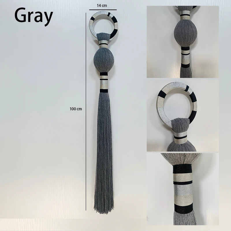Gray decorative ring with tassel on a white background. boho macrame wall art