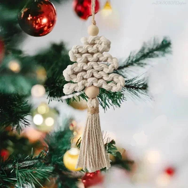 Macrame tree ornament hanging on a Christmas tree with blurred lights in the background