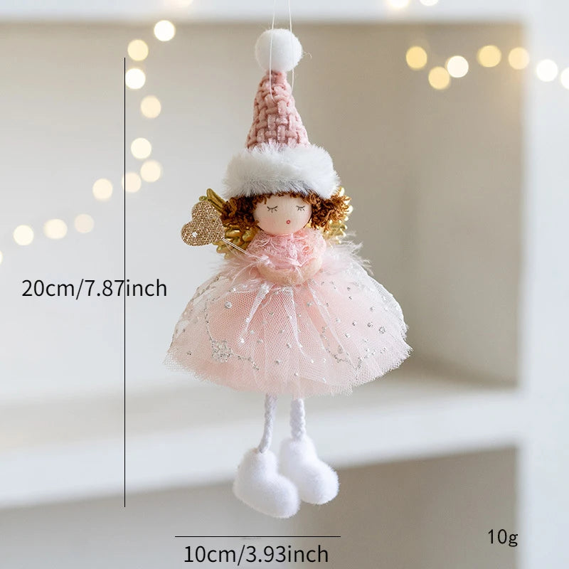 Decorative doll Christmas Ornament with pink dress and hat on a neutral background