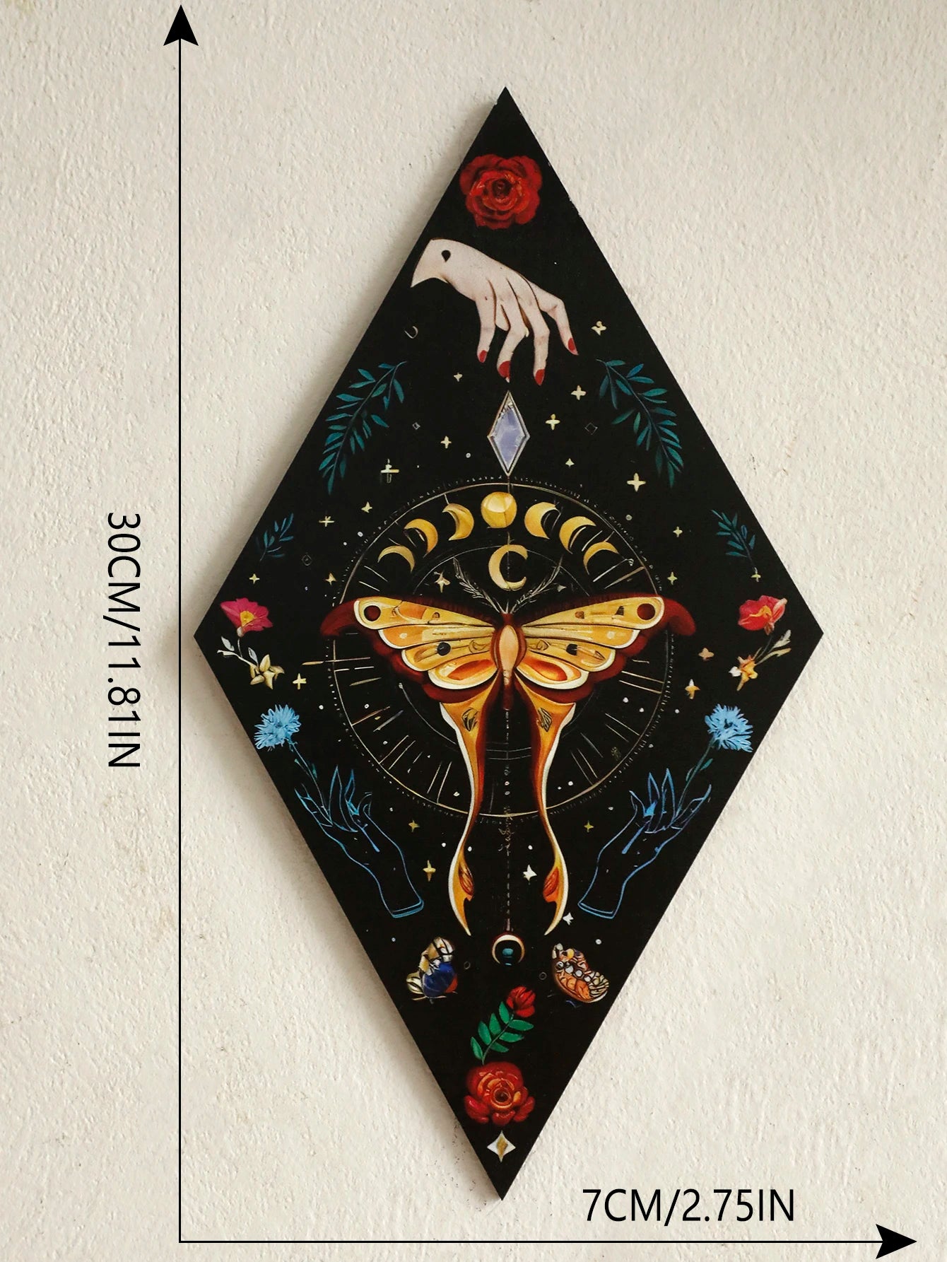 Decorative wall art with a butterfly and hand design, shown with measurements on a plain background. Close-up of butterfly and moon phase wooden wall decoration, showing engraved 3D detailing and vibrant colors