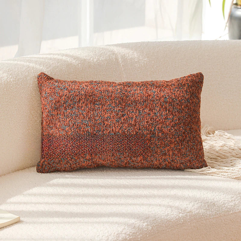 Textured brown pillow on a beige sofa with a blurred background. Modern yarn-dyed throw pillow cover, luxury textured decorative cushion for sofa, bed, or window seating in soft neutral tones.