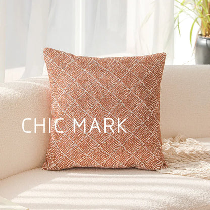 Decorative pillow with 'CHIC MARK' text on a beige couch. Modern yarn-dyed throw pillow cover, luxury textured decorative cushion for sofa, bed, or window seating in soft neutral tones.