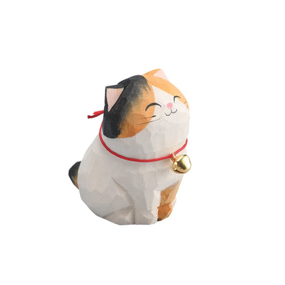 Cat-shaped plush toy with a bell on a white background