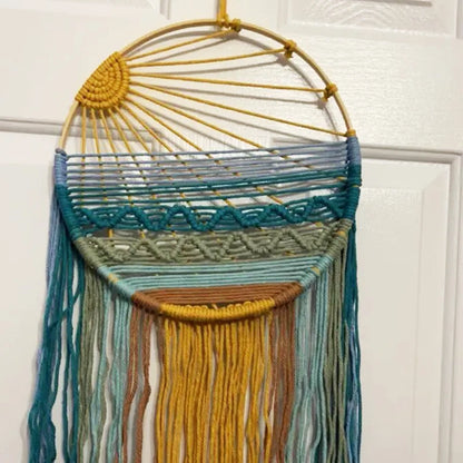 Sunrise & Sunset woven boho wall hanging displayed on wall, Nordic style cotton tapestry featuring warm earthy tones, perfect for boho home decor and eclectic interior design ideas, adds cozy bohemian vibes and textured aesthetic home decor to any living room or bedroom.