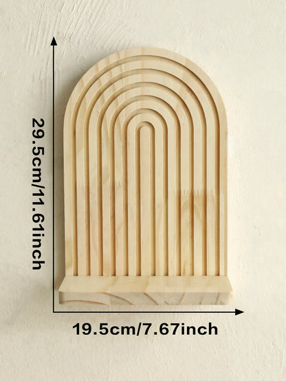 Wooden arch-shaped decorative item with measurements on a beige background